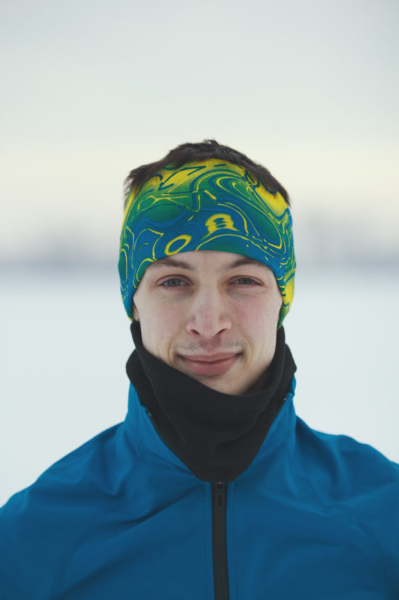 Portrait of a smiling young male athlete in winter, sport and leisure concept